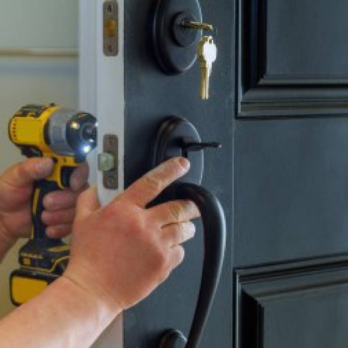 depositphotos_194726416-stock-photo-closeup-professional-locksmith-installing-new